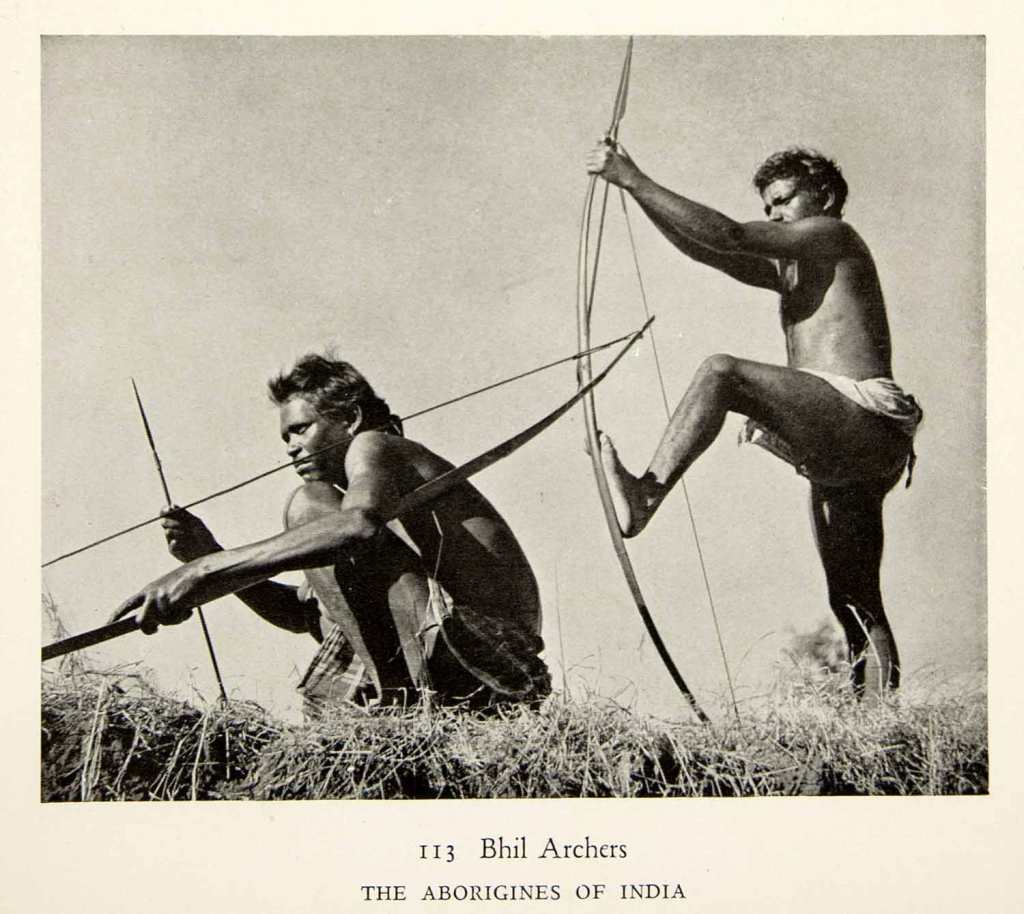 Two Bhil archers preparing for a traditional hunt, showcasing their skills with a bow and arrow.