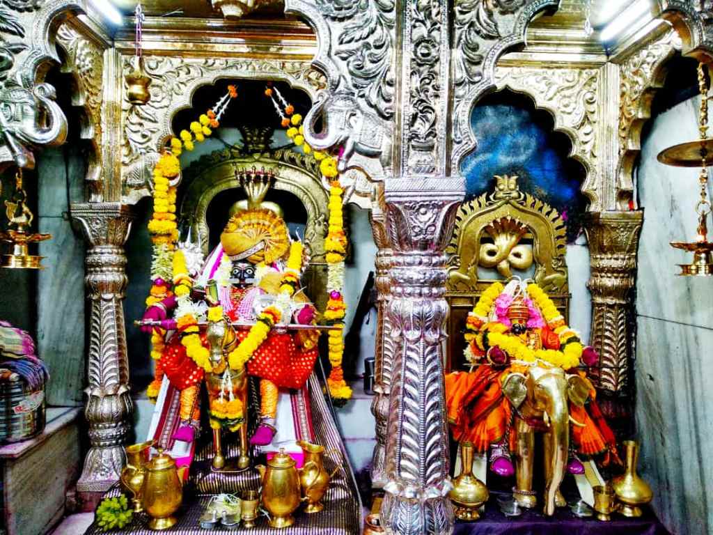 Idols of Shree Siddhanath (left) and Mata Jogeshwari decorated with garlands
